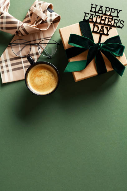 istock Happy Fathers Day flat lay composition with gift box, tie, coffee cup on green background. 2150532002