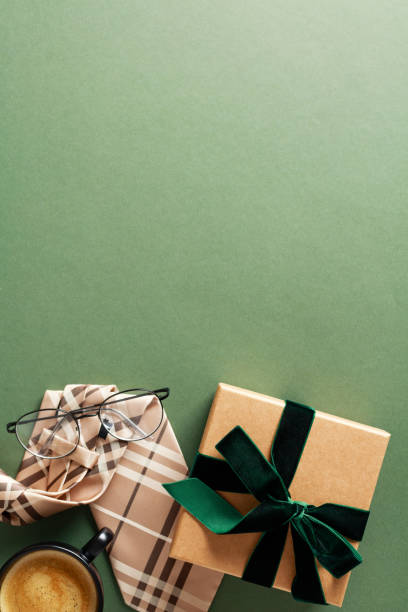 istock Happy Fathers Day, Happy Birthday flat lay composition with gift box, tie, coffee cup on green background. 2150532372