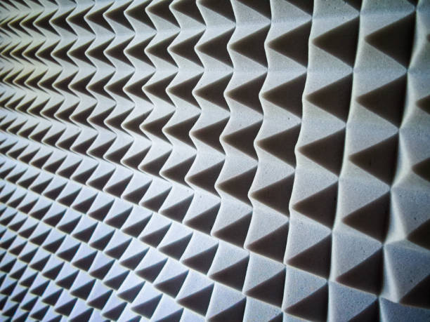 istock Acoustic Foam Panels. Grey pyramid-patterned panels for soundproofing and noise reduction. 2150538018