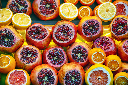 Cut of citrus fruits and pomegranates at street market in Istanbul, Turkey