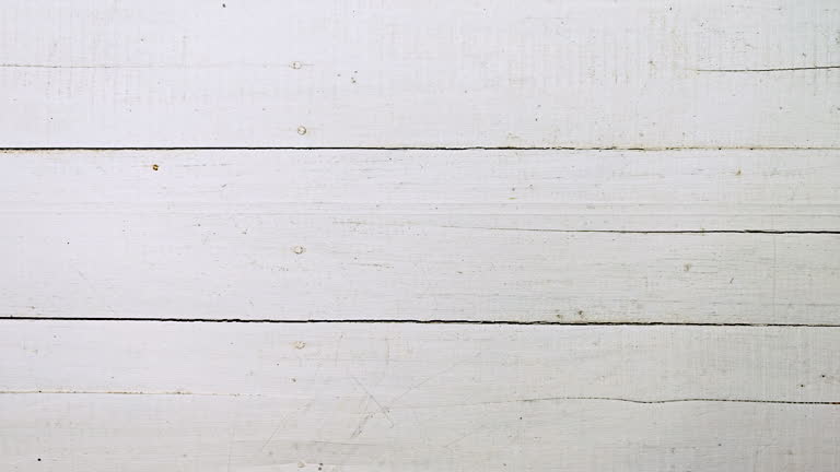 Old white weathered grunge wood plank background.