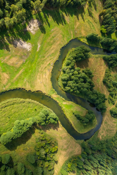 istock beautiful landscape with a small meandering river (aerial view) 2150541827