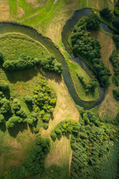 istock beautiful landscape with a small meandering river (aerial view) 2150541894