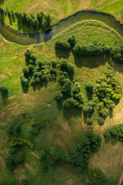 istock beautiful landscape with a small meandering river (aerial view) 2150541899
