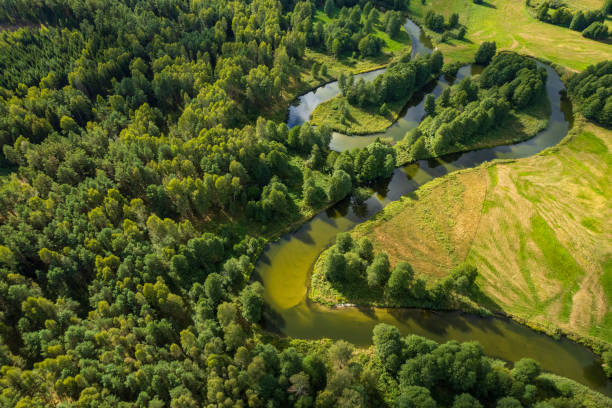 istock beautiful landscape with a small meandering river (aerial view) 2150542099
