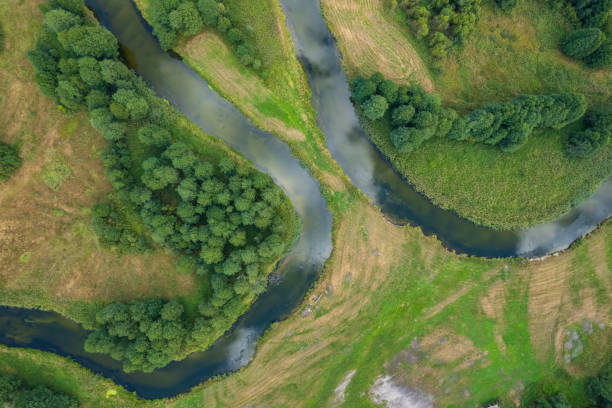 istock beautiful landscape with a small meandering river (aerial view) 2150542345