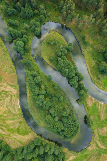 istock beautiful landscape with a small meandering river (aerial view) 2150542416