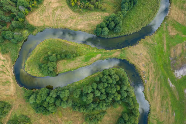 istock beautiful landscape with a small meandering river (aerial view) 2150543248