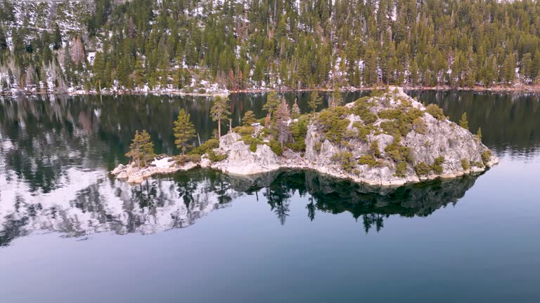 Aerial view of Emerald Bay island with mountains in water reflection, Lake Tahoe, California