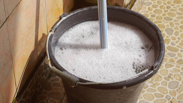 istock A mop and a bucket of soapy water. 2150545358
