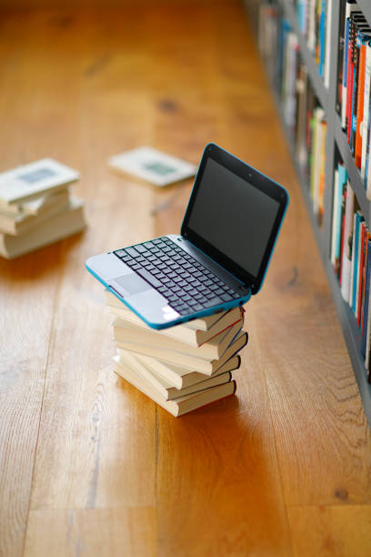 istock Laptop in front of a bookshelf 2150548163
