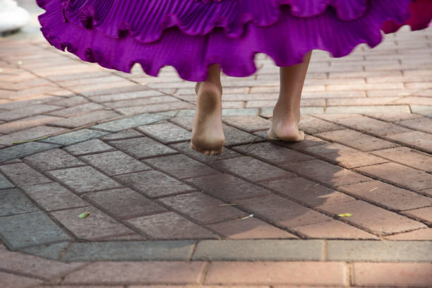 Low Section Of Girl Walking In Summer