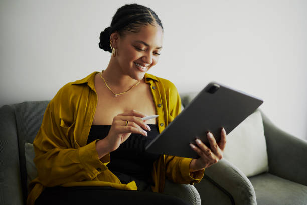 istock Happy Woman Using Digital Tablet at Home/Office 2150548526