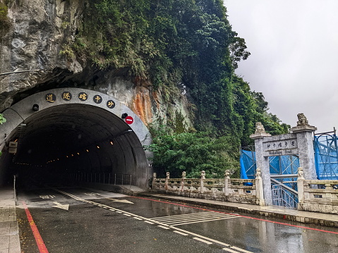 Taroko, Taiwan - 11.26.2022: Entrance to the Shakadang Tunnel on the Shakadang Bridge with staircase to the Shakadang Trail closed for maintenance during the pandemic before 403 earthquake