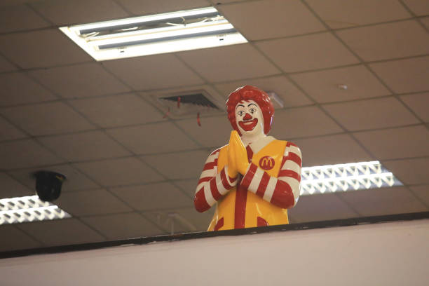 Chiang Mai/Thailand- 2019 December 28: the mcdonald restaurant with the specific statue, the namaste style uncle in Chiang Mai international airport