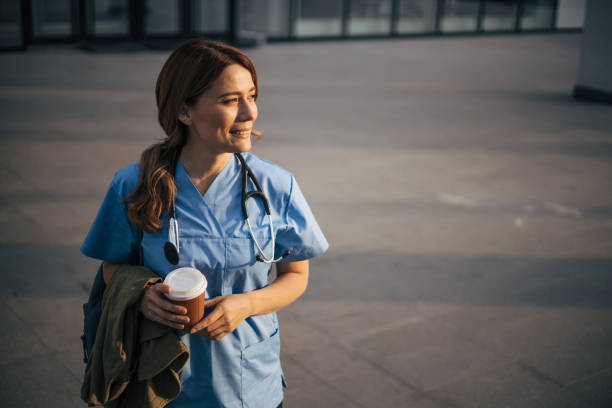 istock Beautiful attractive female doctor on morning shift on coffee break. 2150555434