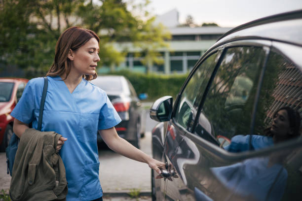 istock a beautiful female doctor has finished her work and is getting into the car. 2150556080
