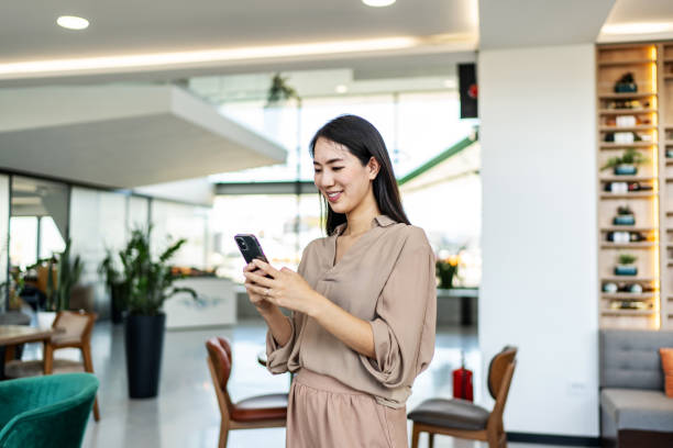 istock Asian businesswoman using cell phone 2150556113