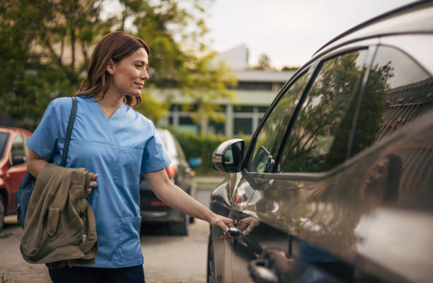 istock a beautiful female doctor has finished her work and is getting into the car. 2150556131