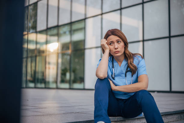 istock The female doctor looked tired. 2150556577