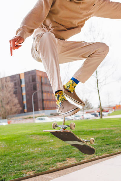 istock Unrecognizable man doing an ollie trick with skateboard. Close-up view. 2150557630