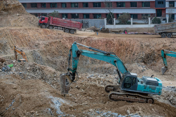 istock The gravel machine on the construction site is working 2150557949