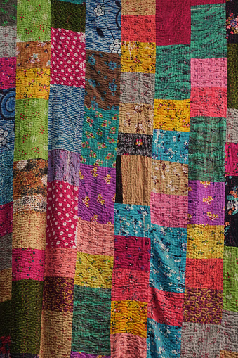 Godhadi (Blanket) Is A Traditional Hand Stitched handmade quilt from Jodhpur, Rajasthan, India. Godadi is a Gujarati word for a blanket. It is an embroidered blanker and made by patching various pieces of cloth.