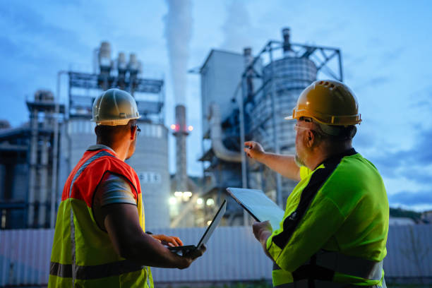 istock Team of engineers working a night shift at the factory 2150561569