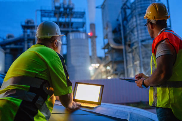 istock Team of engineers working a night shift at the factory 2150561603