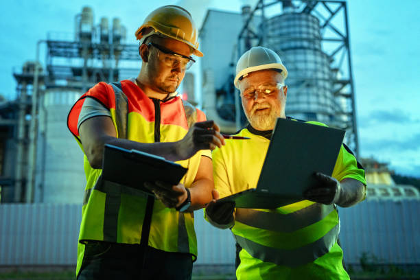 istock Team of engineers working a night shift at the factory 2150561611
