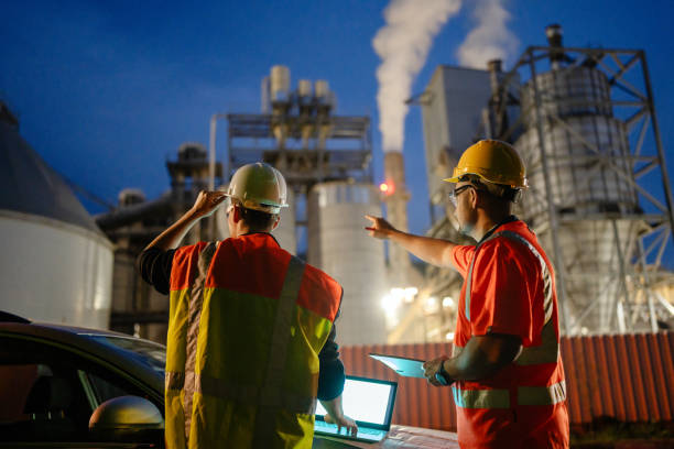 istock Team of engineers working a night shift at the factory 2150561628