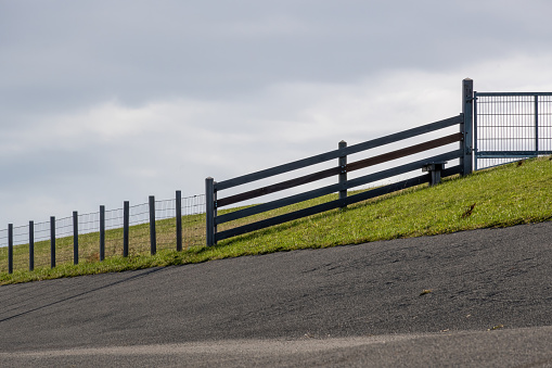 white fence and Green pastures of horse farms