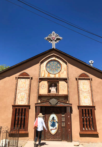 istock Chimayo, NM: Tourist Entering Santo Nino Chapel 2150561853
