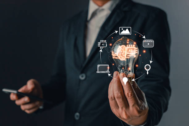 istock Man hold lightbulb icon ai and use smartphone, Marketers education, research, analyze media video streaming content creation and online marketing strategies to grow their digital business. 2150561929
