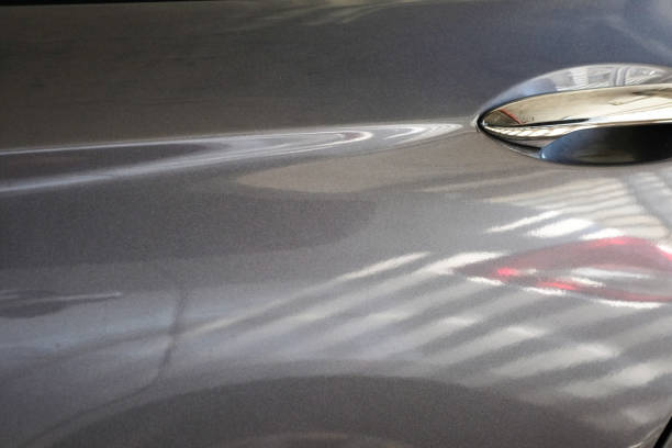 reflect of car and abstract form on metal