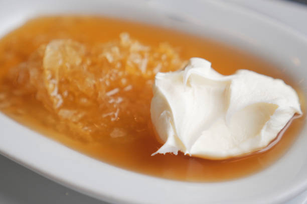 istock butter cream and honey in a bowl on table . 2150563806