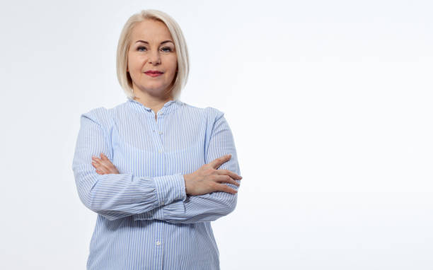 istock Serious business woman with folded arms on white background 2150566300