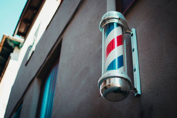 istock A barber pole hung on the wall of a building facade 2150566706