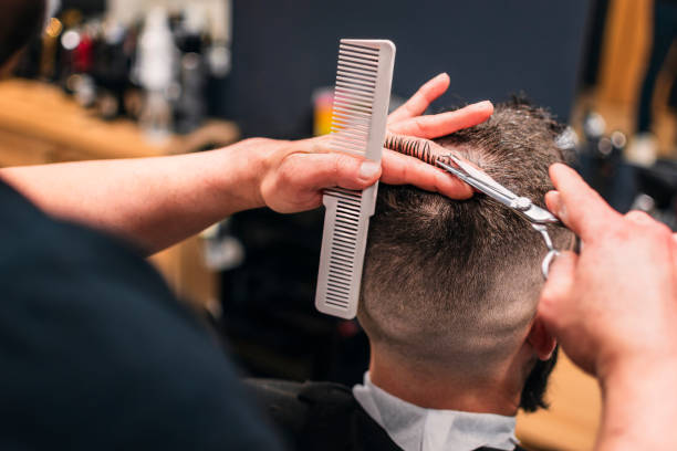 istock A man is getting his hair cut by a barber. Casual 2150566720