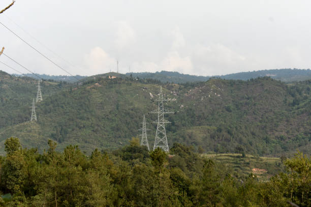 istock Power transmission towers standing tall on hilltop. High-voltage cables stretch from the metallic structure, carrying electricity across the hilly landscape in Meghalaya. 2150568727