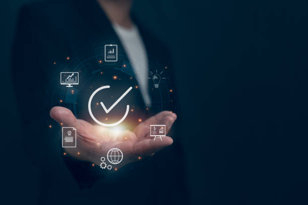 istock Businessman with guarantee check for client service. Client service and guarantee checkmark in business automation, quality management, online shopping, business automation, and financial ecosystem. 2150568962