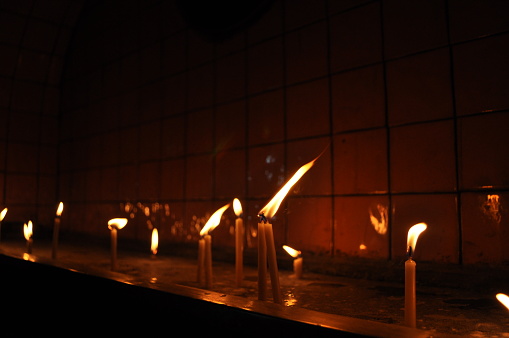 glowing candles in the dark