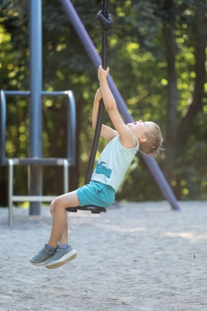 istock Happy little boy rolling on a forest walking trail attraction. 2150577828