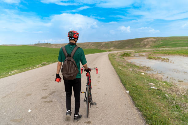 Athlete cycling outdoors. Doing sports in nature.