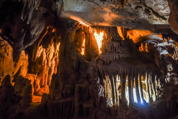 A shot of a beautiful cave, massive columns of stalagmites and stalactites