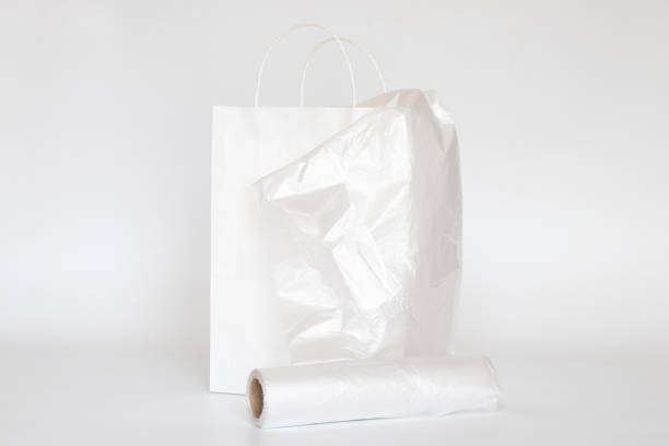 istock White paper bag and plastic transparent bag on a white background 2150580862