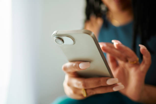 istock Connected Fingertips: Woman Texting on Mobile Phone 2150583336