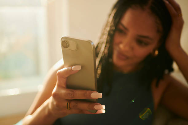 istock Pure Relaxation: A Woman Texting On A Mobile Phone 2150583394