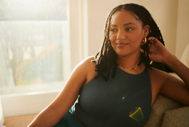 istock Golden Hour Glow: Beautiful Woman Relaxing at Home 2150583396