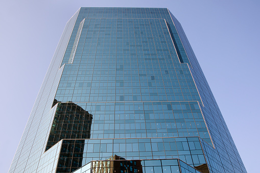 Reflection of cityscape in glassy building, Philadelphia, USA